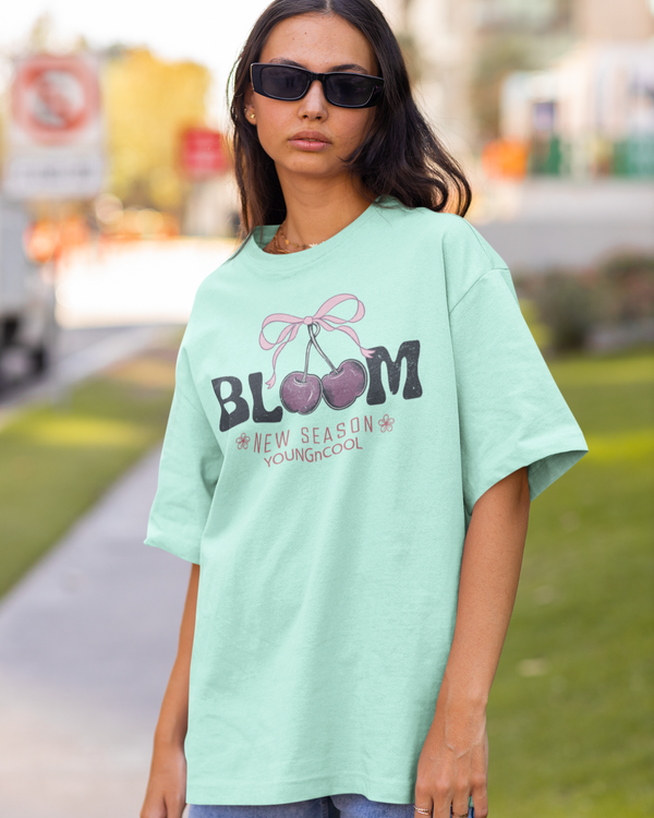 Teen girl wearing oversized graphic t-shirt with 'Bloom Image' design – streetwear style by YoungnCool - YnCLife