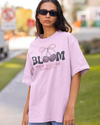 Teen girl wearing oversized graphic t-shirt with 'Bloom Image' design – streetwear style by YoungnCool - YnCLife