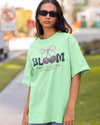 Teen girl wearing oversized graphic t-shirt with 'Bloom Image' design – streetwear style by YoungnCool - YnCLife