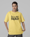 Teen girl wearing oversized graphic t-shirt with 'Book Nerd' design – streetwear style by YoungnCool-YnClife