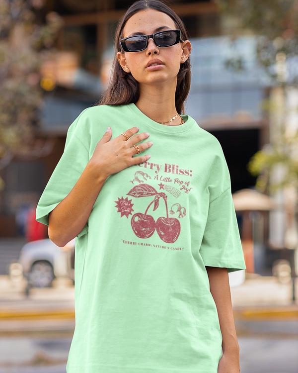 Teen girl wearing oversized graphic t-shirt with 'Cherry Bliss' design – streetwear style by YoungnCool-YnCLife