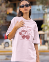Teen girl wearing oversized graphic t-shirt with 'Cherry Bliss' design – streetwear style by YoungnCool-YnCLife