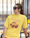 Teen girl wearing oversized graphic t-shirt with 'Cherry Bliss' design – streetwear style by YoungnCool-YnCLife