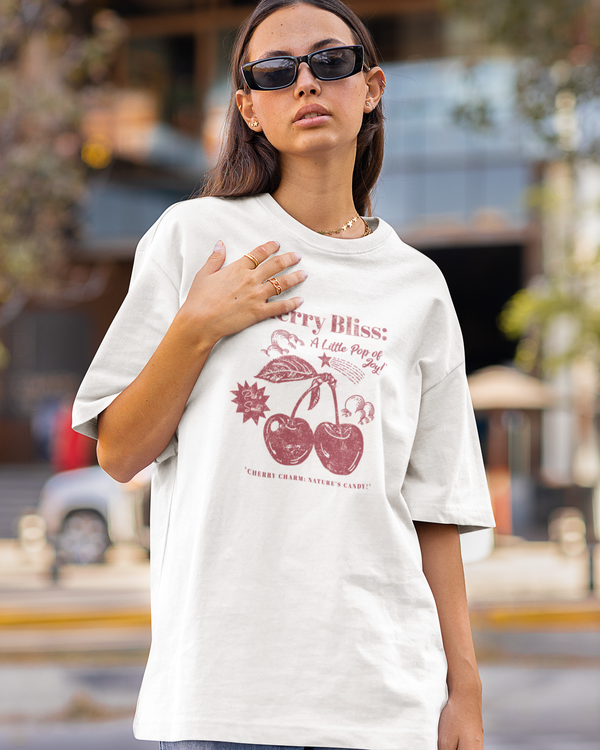 Teen girl wearing oversized graphic t-shirt with 'Cherry Bliss' design – streetwear style by YoungnCool-YnCLife
