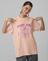 Teen girl wearing oversized graphic t-shirt with 'Cherry Bomb' design – streetwear style by YoungnCool-YnCLife