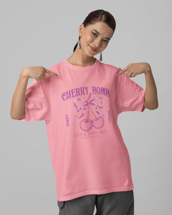 Teen girl wearing oversized graphic t-shirt with 'Cherry Bomb' design – streetwear style by YoungnCool-YnCLife