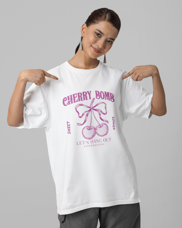 Teen girl wearing oversized graphic t-shirt with 'Cherry Bomb' design – streetwear style by YoungnCool-YnCLife