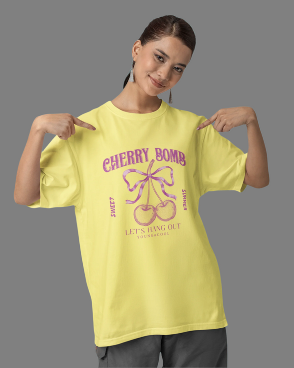 Teen girl wearing oversized graphic t-shirt with 'Cherry Bomb' design – streetwear style by YoungnCool-YnCLife