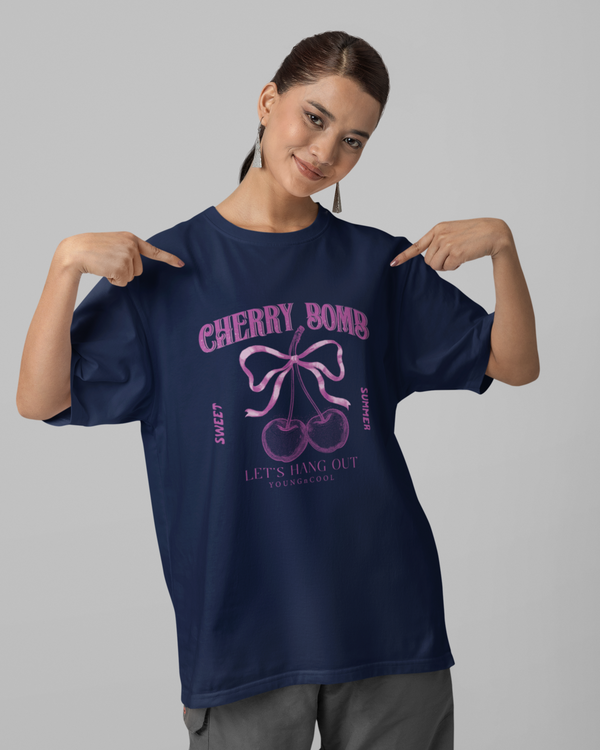 Teen girl wearing oversized graphic t-shirt with 'Cherry Bomb' design – streetwear style by YoungnCool-YnCLife