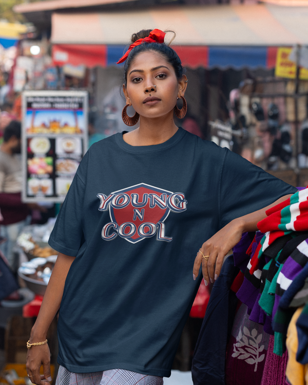 Teen girl wearing oversized graphic t-shirt with design – streetwear style by YoungnCool.