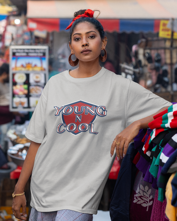 Teen girl wearing oversized graphic t-shirt with design – streetwear style by YoungnCool.