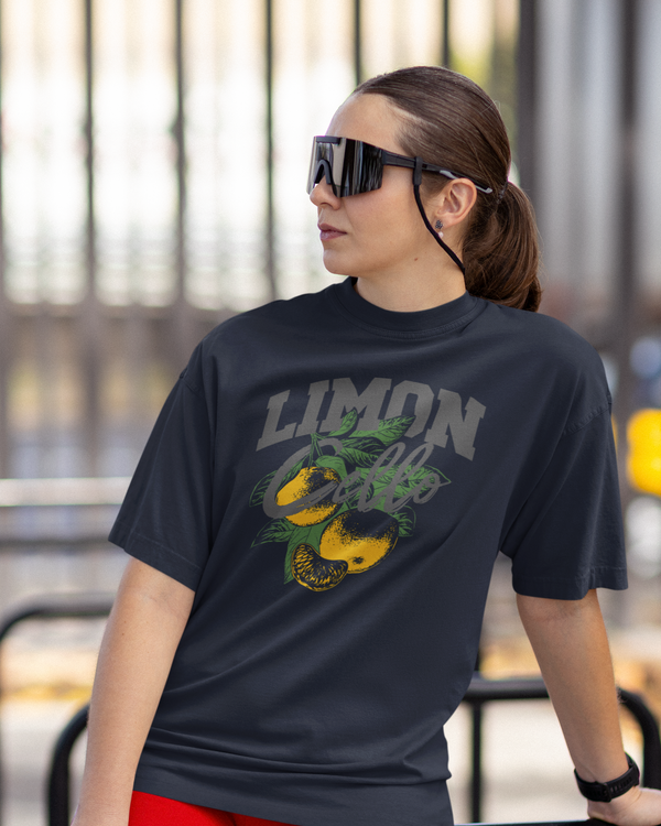 Teen girl wearing oversized graphic t-shirt with 'Lemons Print' design – streetwear style by YoungnCool.