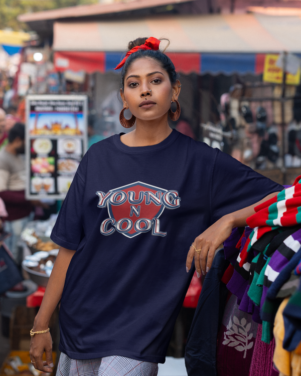Teen girl wearing oversized graphic t-shirt with design – streetwear style by YoungnCool.