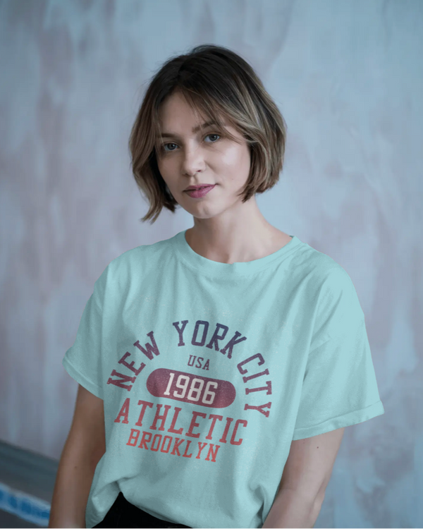 Teen girl wearing blue oversized graphic t-shirt with 'New York City Print' design – streetwear style by YoungnCool.