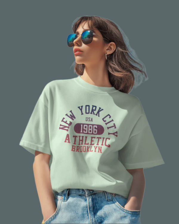 Teen girl wearing green oversized graphic t-shirt with 'New York City Print' design – streetwear style by YoungnCool.
