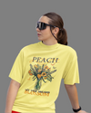 Teen girl wearing oversized graphic t-shirt with 'Peach Print' design – streetwear style by YoungnCool-YnCLife