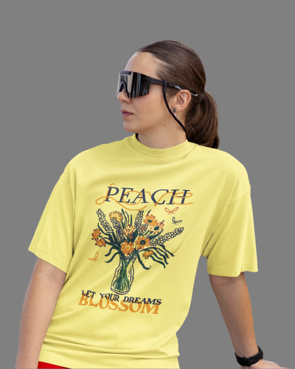 Teen girl wearing oversized graphic t-shirt with 'Peach Print' design – streetwear style by YoungnCool-YnCLife
