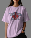 Teen girl wearing oversized graphic t-shirt with design – streetwear style by YoungnCool.
