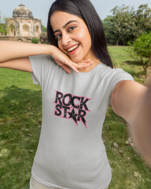 Teen girl wearing oversized graphic t-shirt with 'Rock Star' design – streetwear style by YoungnCool.