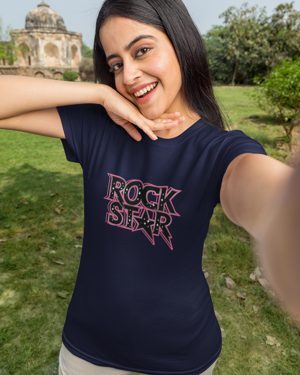 Teen girl wearing oversized graphic t-shirt with 'Rock Star' design – streetwear style by YoungnCool.