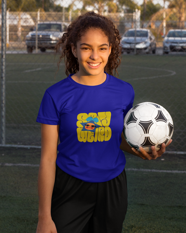 Teen girl wearing graphic t-shirt with 'stay weird Quote' design – streetwear style by YoungnCool YnCLife