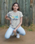 Teen girl wearing graphic t-shirt with 'Sunshine Fruits' design – streetwear style by YoungnCool.