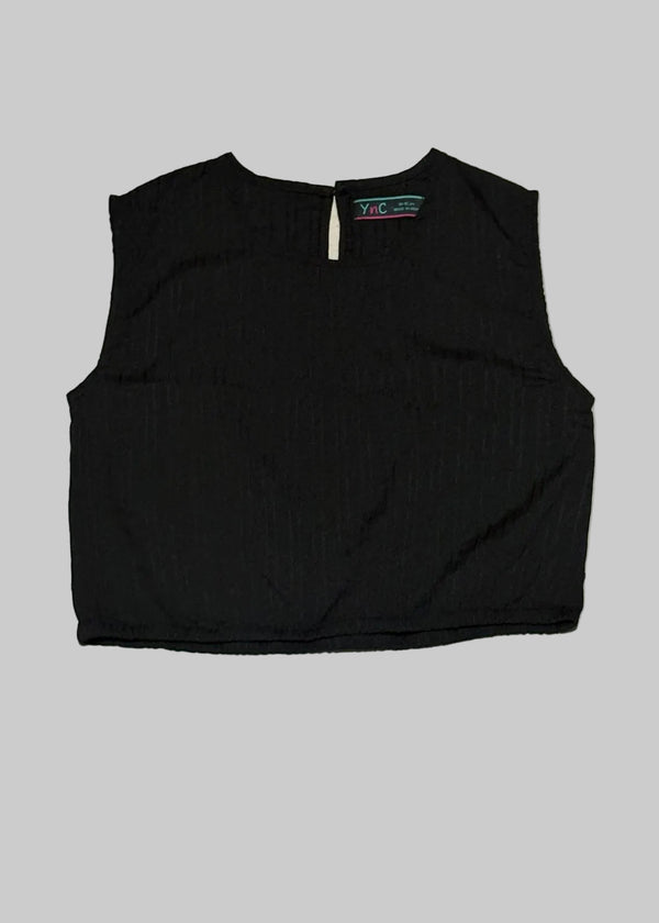 Black sleeveless top on a light gray background