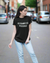 Teen girl wearing graphic t-shirt with 'ASAP Quote' design – streetwear style by YoungnCool.