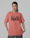 Teen girl wearing oversized graphic t-shirt with 'Book Nerd' design – streetwear style by YoungnCool-YnClife