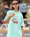Teen girl wearing oversized graphic t-shirt with 'Cherry Bliss' design – streetwear style by YoungnCool-YnCLife