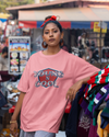 Teen girl wearing oversized graphic t-shirt with design – streetwear style by YoungnCool.