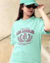 Teen girl wearing oversized graphic t-shirt with 'LA Print' design – streetwear style by YoungnCool YnCLife