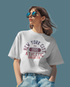 Teen girl wearing whitea oversized graphic t-shirt with 'New York City Print' design – streetwear style by YoungnCool.
