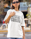 Teen girl wearing oversized graphic t-shirt with 'Serial Chiller' design – streetwear style by YoungnCool-YnCLife