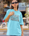 Teen girl wearing oversized graphic t-shirt with 'Serial Chiller' design – streetwear style by YoungnCool-YnCLife
