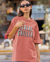 Teen girl wearing oversized graphic t-shirt with 'Serial Chiller' design – streetwear style by YoungnCool-YnCLife