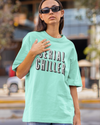 Teen girl wearing oversized graphic t-shirt with 'Serial Chiller' design – streetwear style by YoungnCool-YnCLife