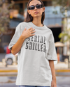 Teen girl wearing oversized graphic t-shirt with 'Serial Chiller' design – streetwear style by YoungnCool-YnCLife