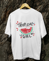 Teen girl wearing oversized graphic t-shirt with 'Tropical Girl' design – streetwear style by YoungnCool.