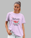 Teen girl wearing oversized graphic t-shirt with 'Tropical Girl' design – streetwear style by YoungnCool.