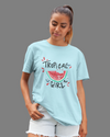 Teen girl wearing oversized graphic t-shirt with 'Tropical Girl' design – streetwear style by YoungnCool.