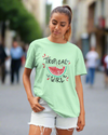 Teen girl wearing oversized graphic t-shirt with 'Tropical Girl' design – streetwear style by YoungnCool.