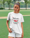 Teen girl wearing oversized graphic t-shirt with 'Tropical Girl' design – streetwear style by YoungnCool.